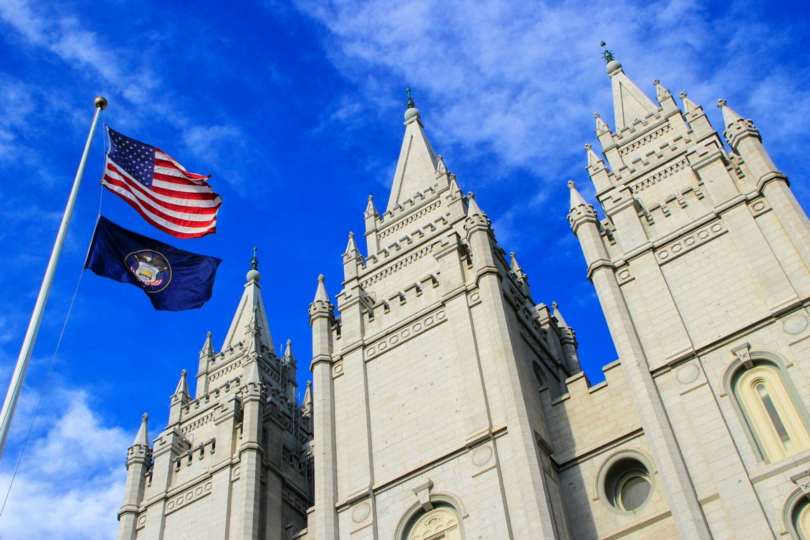 The Church of Jesus Christ of Latter-Day Saints in Salt Lake City, with the U.S. and Utah flags flying on a pole outside - Sexual Abuse in the Church of Jesus Christ of Latter-day Saints (Mormon) Church