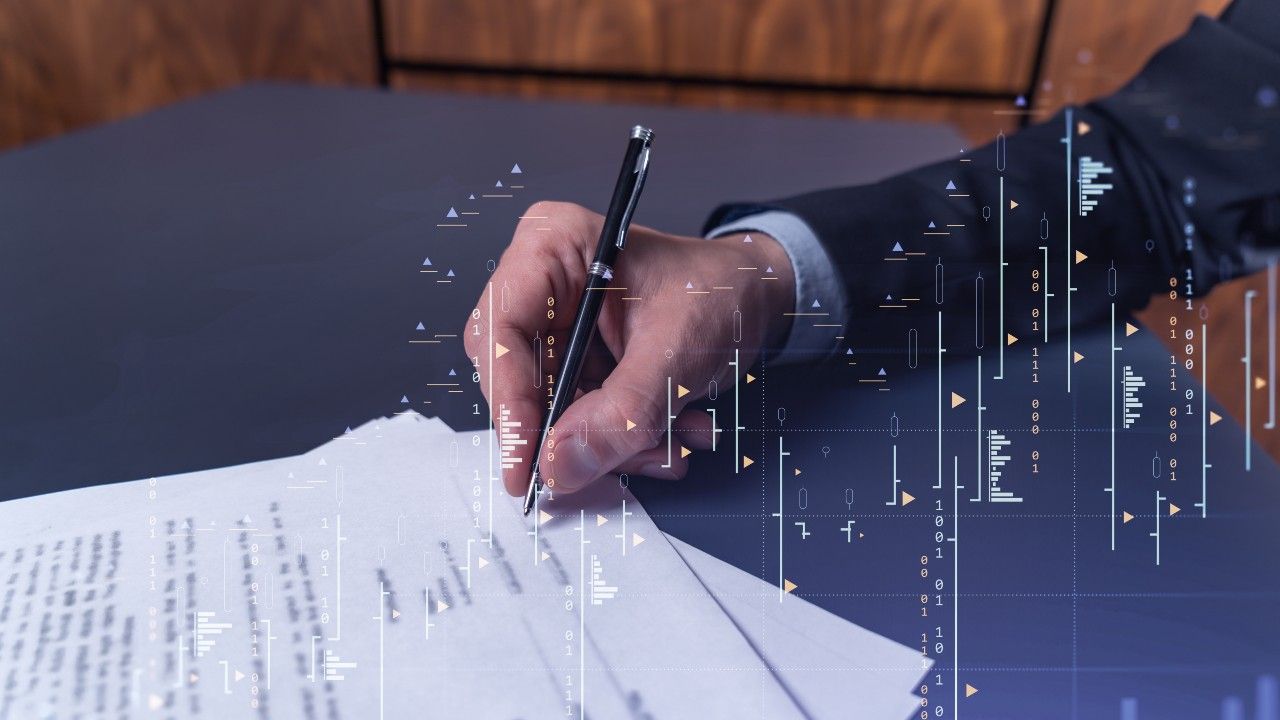 numbers and graphs overlaying a lawyer signing papers